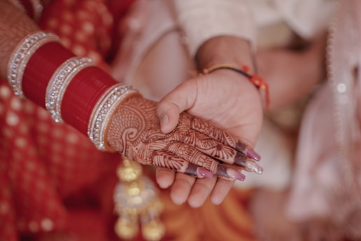 a close up of a person holding another person's hand