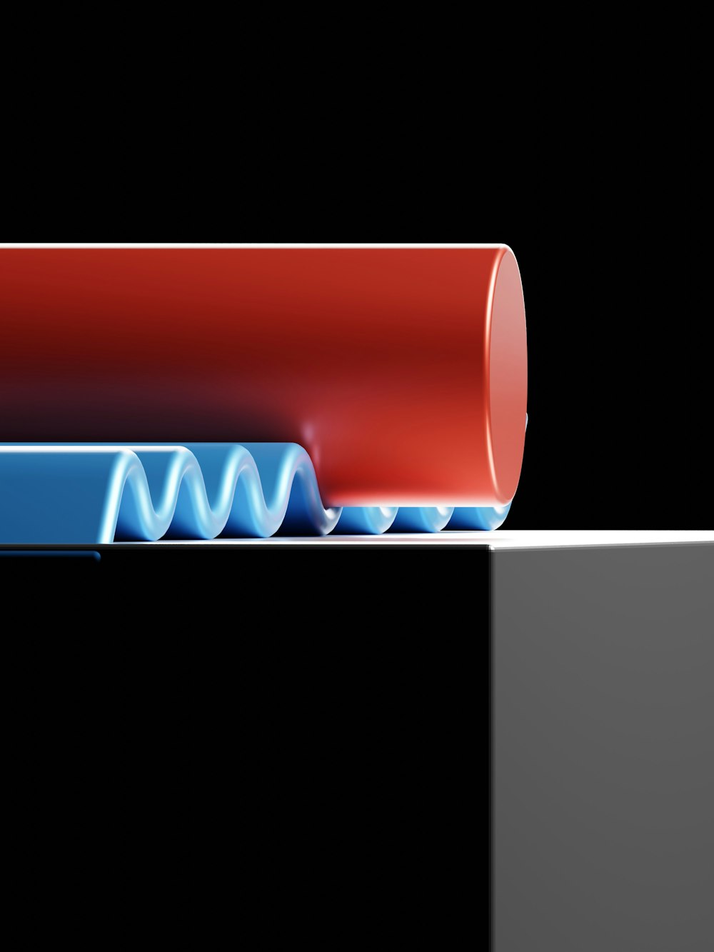 un tube rouge avec un tube bleu sur le dessus