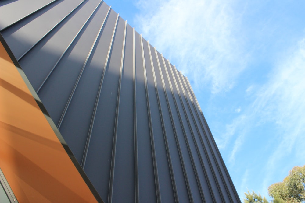 a close up of a building with a blue sky in the background