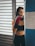 a woman in a sports bra and boxing gloves