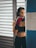 a woman in a sports bra and boxing gloves