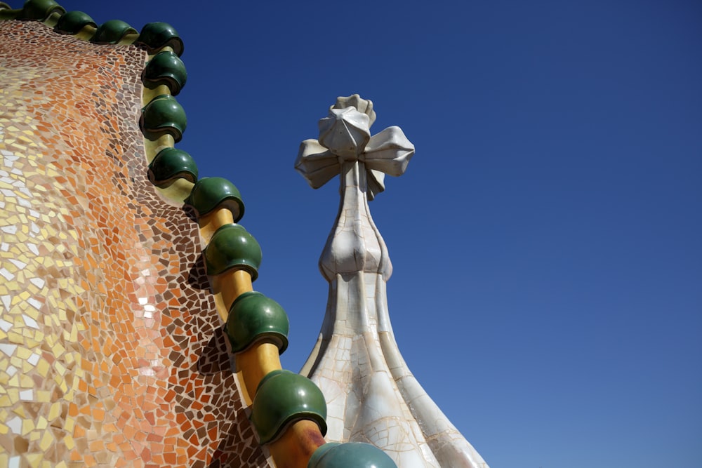 a close up of a building with a cross on top