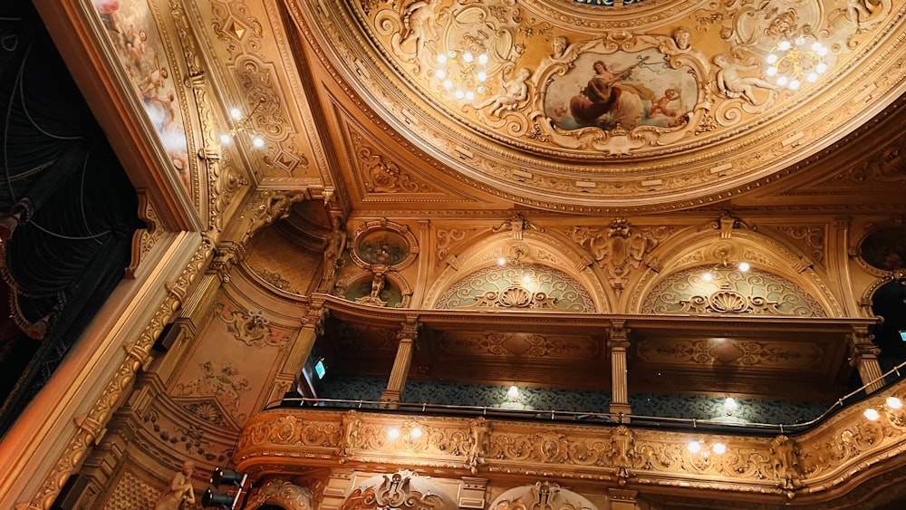 the ceiling of a building with a clock on it