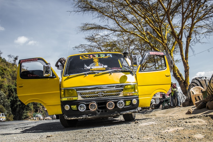 A group of minibus owners gathered in a lively meeting, discussing federation plans with enthusiasm.