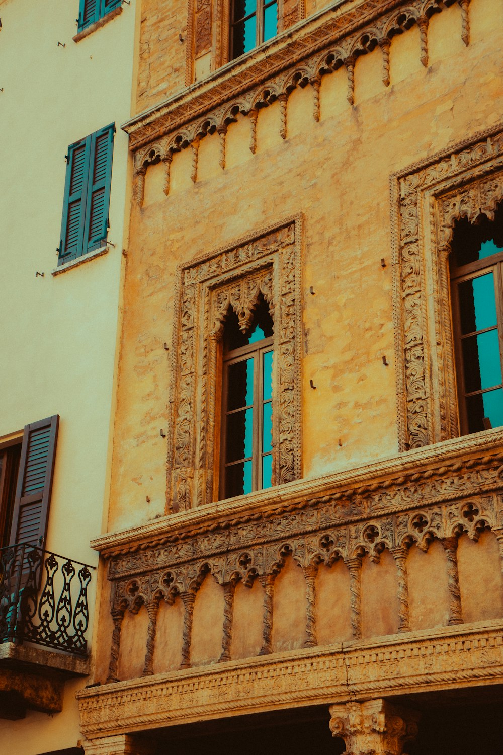 an old building with a clock on the front of it