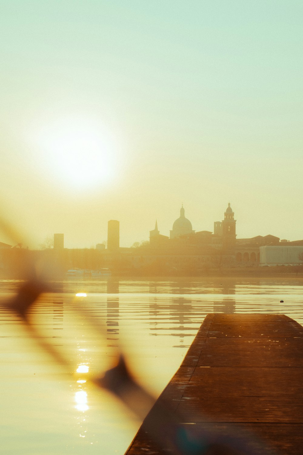 a view of a body of water with a city in the background