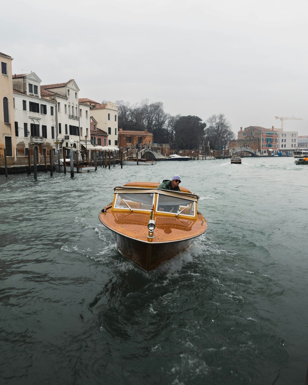 a small boat in the middle of a body of water