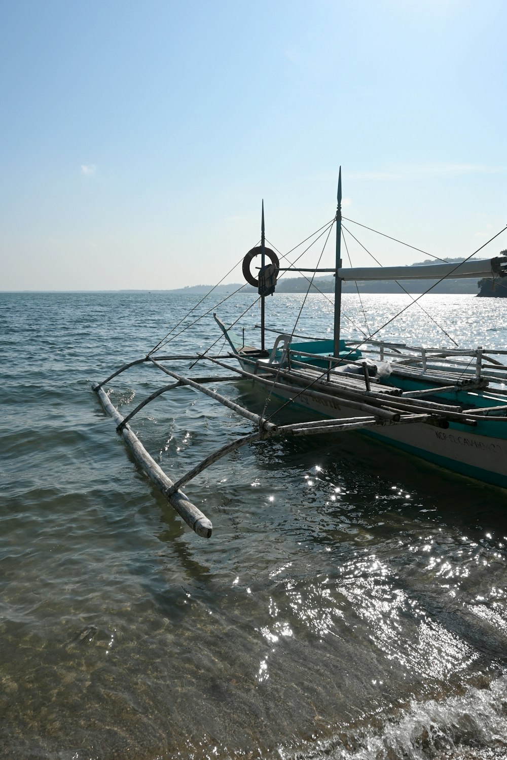 a boat sitting on top of a body of water