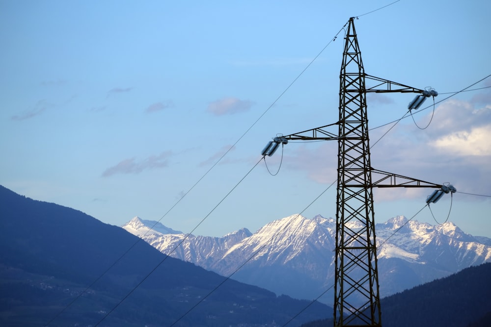 a power line with mountains in the background