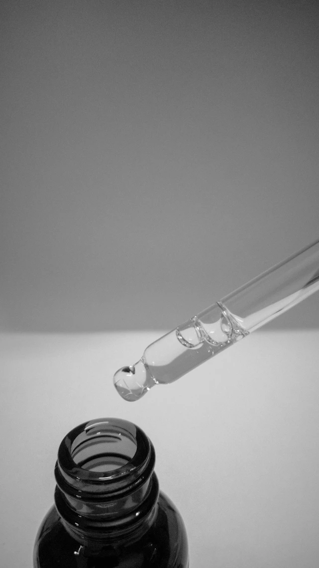 a glass bottle with a liquid inside of it