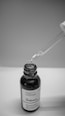 a dropper filled with a liquid sitting on top of a table