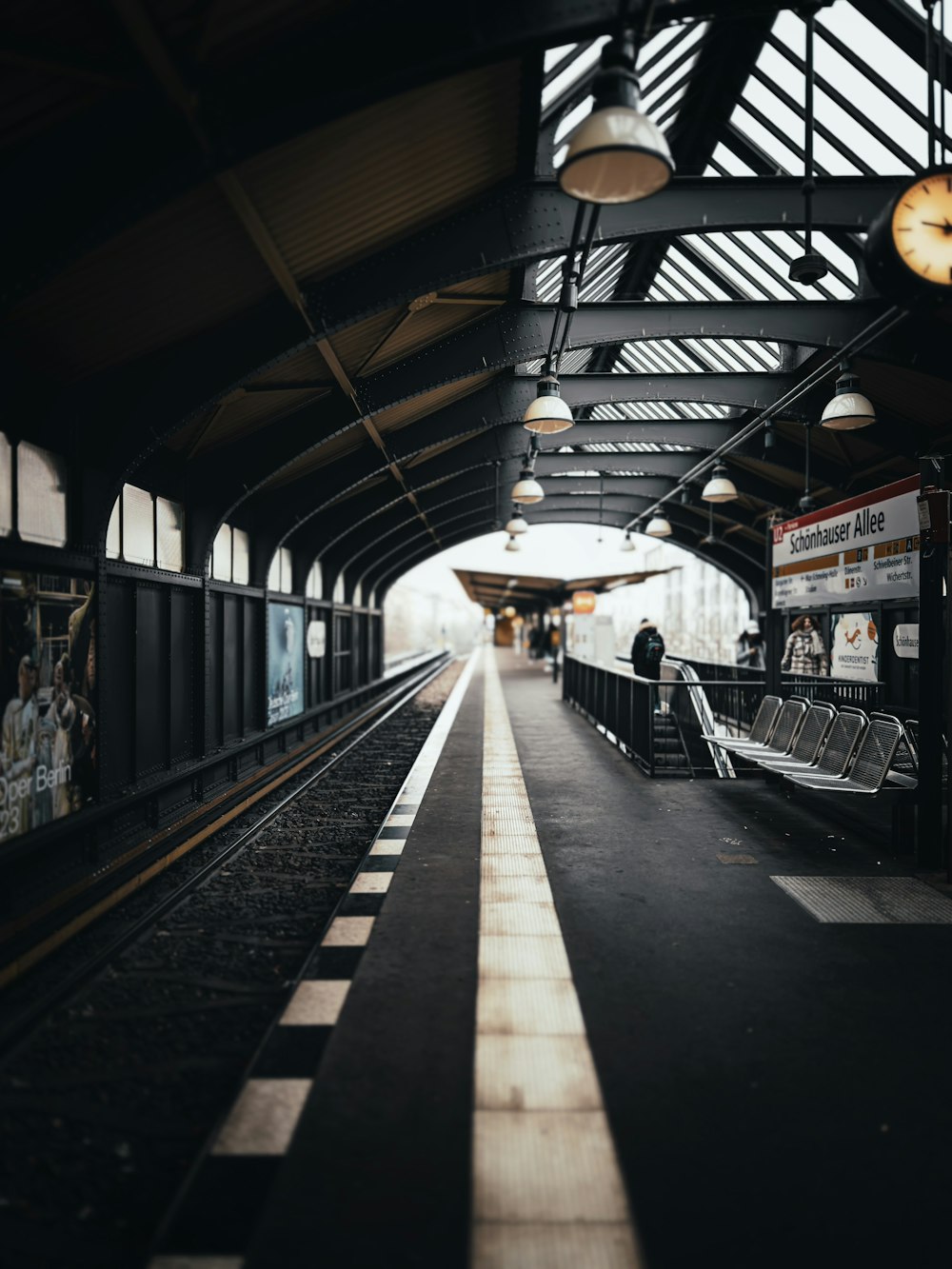 a train station with a train on the tracks