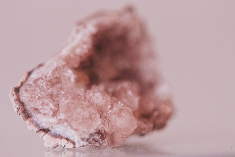 a close up of a piece of pink rock