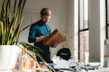 A confident doctor reviewing financial documents in a modern office.
