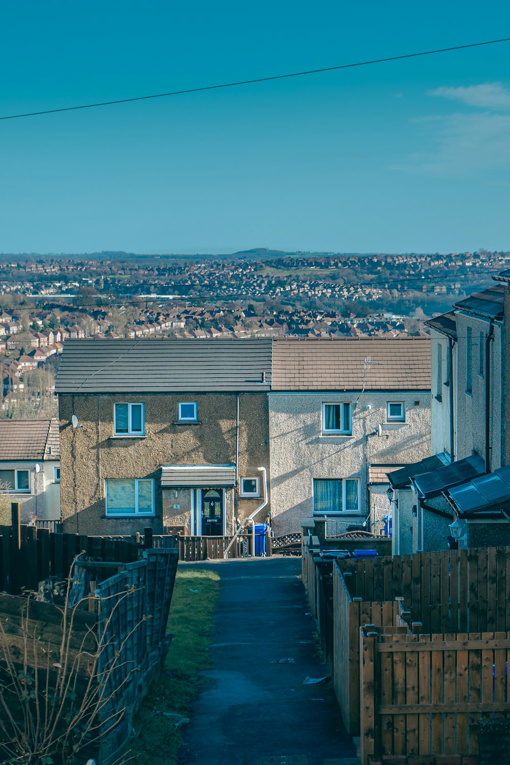 a view of a residential area with houses in the background