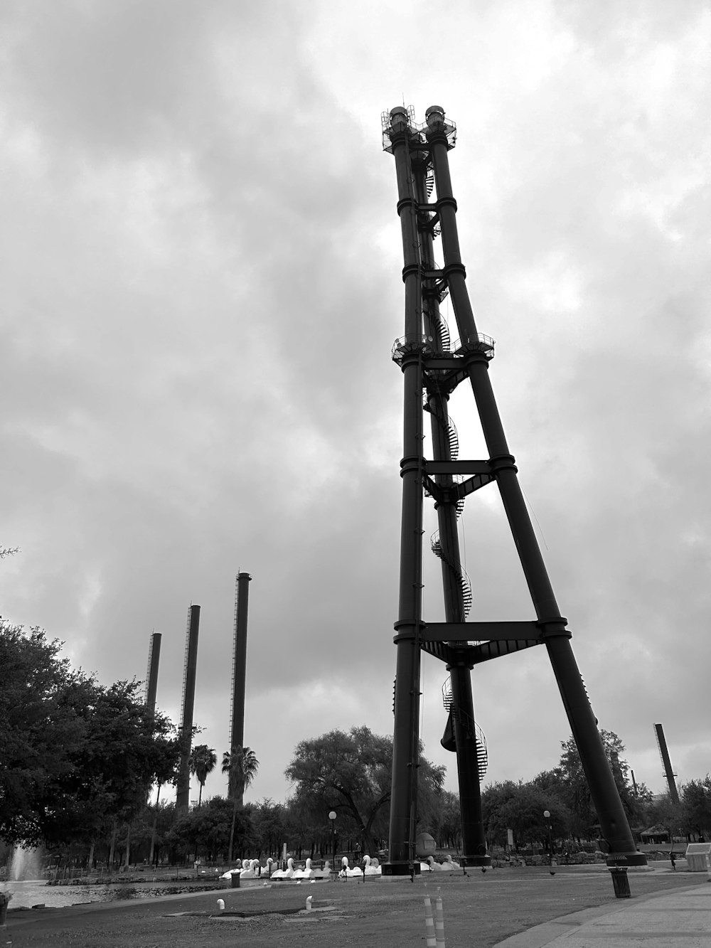 a tall metal structure sitting on the side of a road