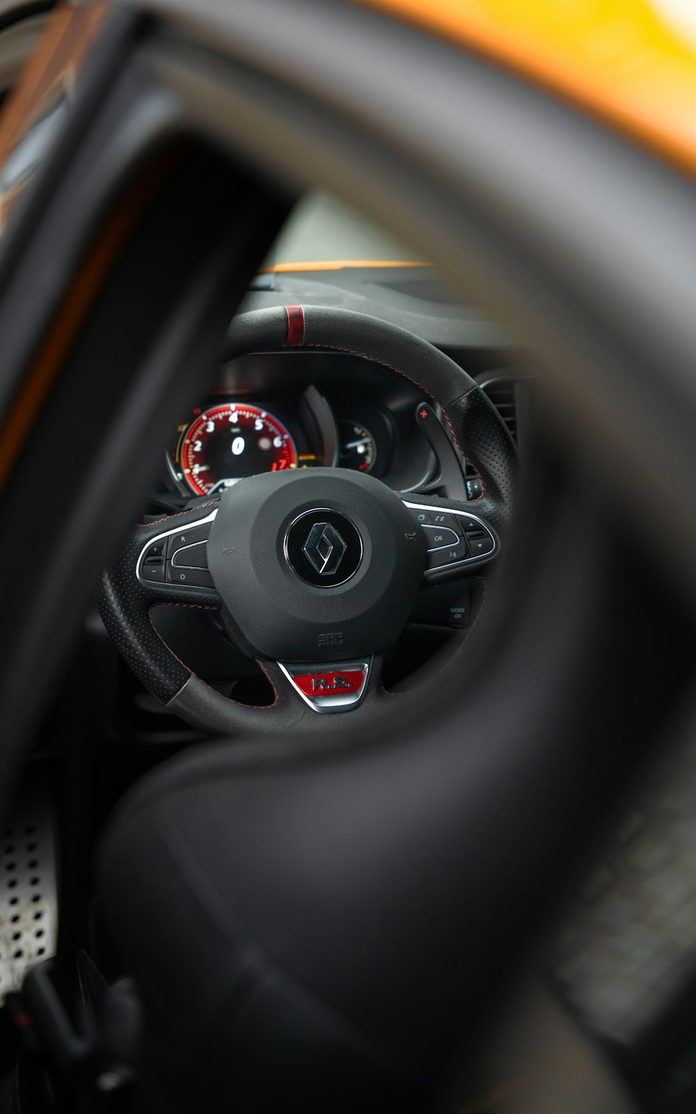 a steering wheel and dashboard of a car