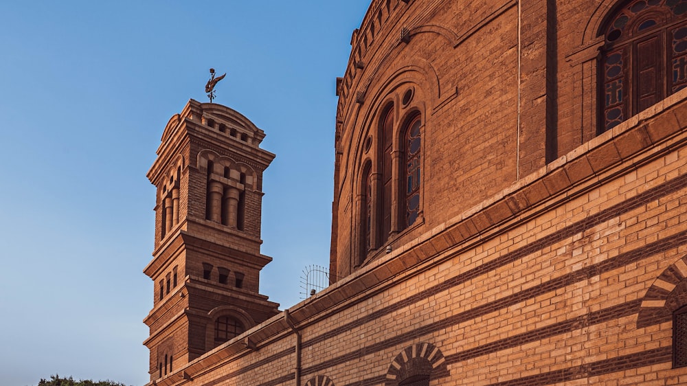 a tall brick building with a clock tower