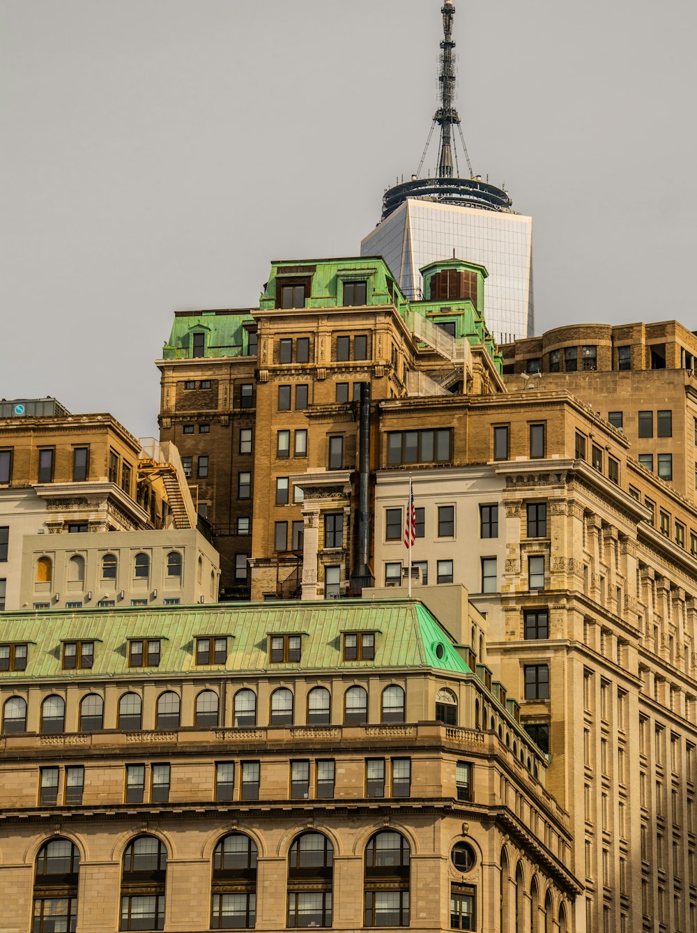 a view of a building with a television tower in the background