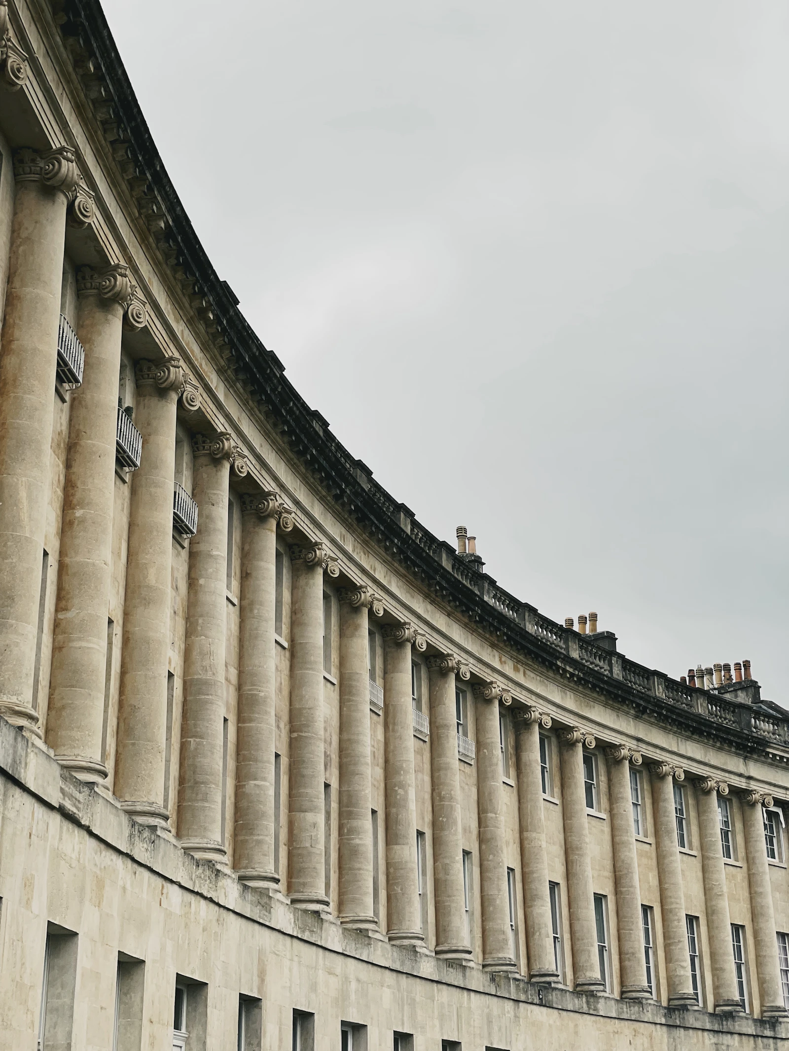 The Royal Crescent, a curved terrace of Georgian townhouses in Bath stone.