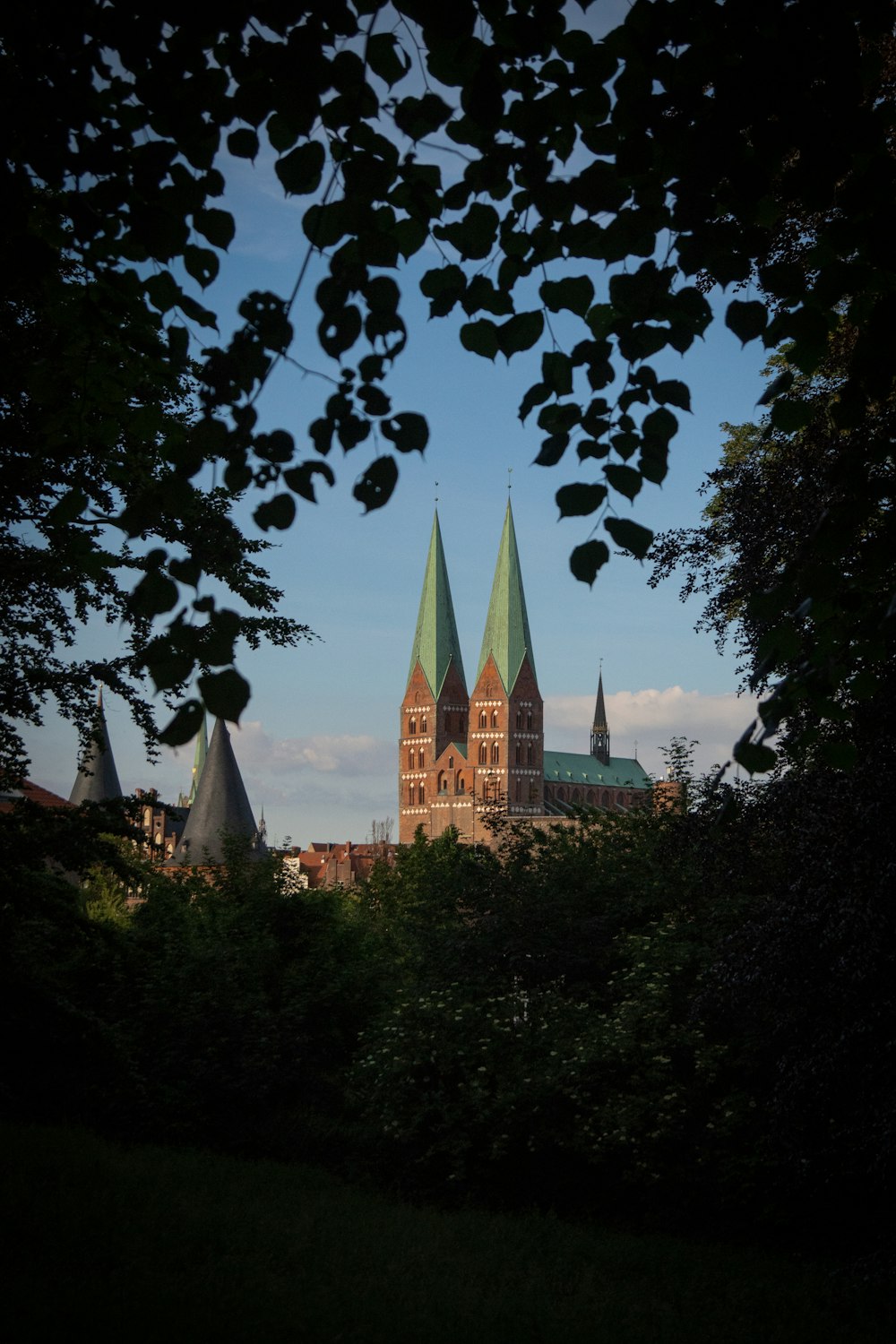 a large building with green spires on top of it