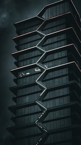 a tall building with a spiral design on the side