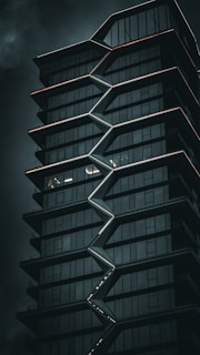 a tall building with a spiral design on the side