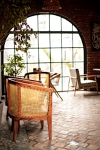 a chair and table in a room with a big window