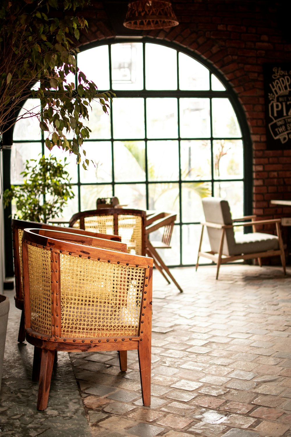 a chair and table in a room with a big window