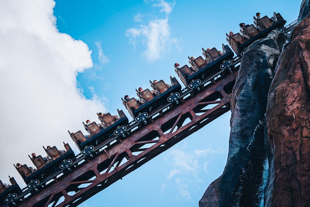 a roller coaster with many cars on top of it