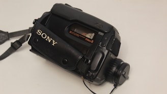 a sony camera sitting on a white table