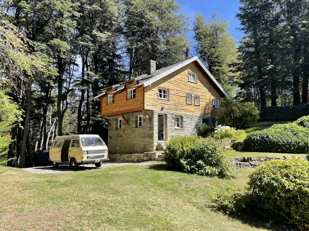 a van is parked in front of a house