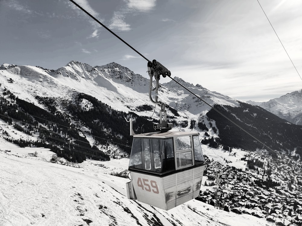 a ski lift going up a snowy mountain