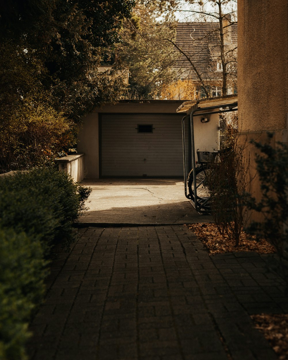 a bicycle parked in front of a garage