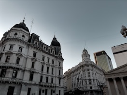 a large building with a clock on the top of it
