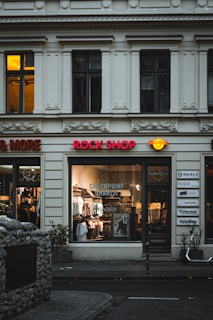 a store front with a motorcycle parked in front of it