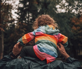 a man holding a child in his arms