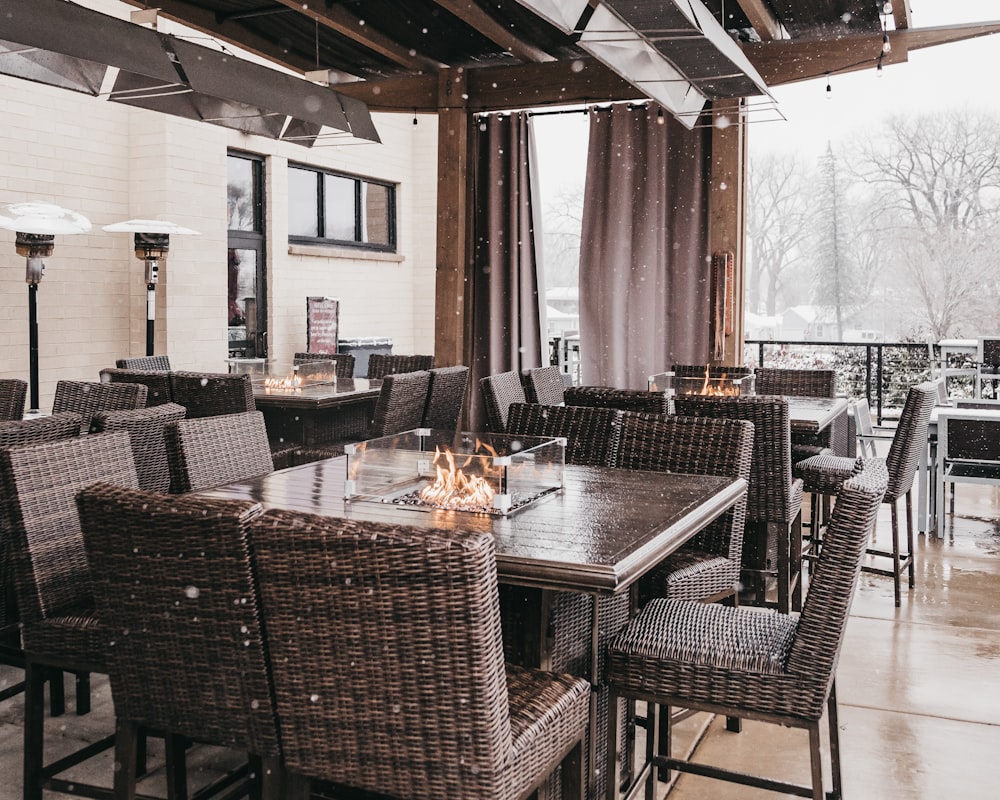 a dining room with a table and chairs and a fire place