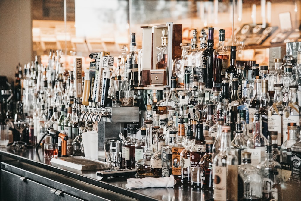 a bar filled with lots of bottles of liquor