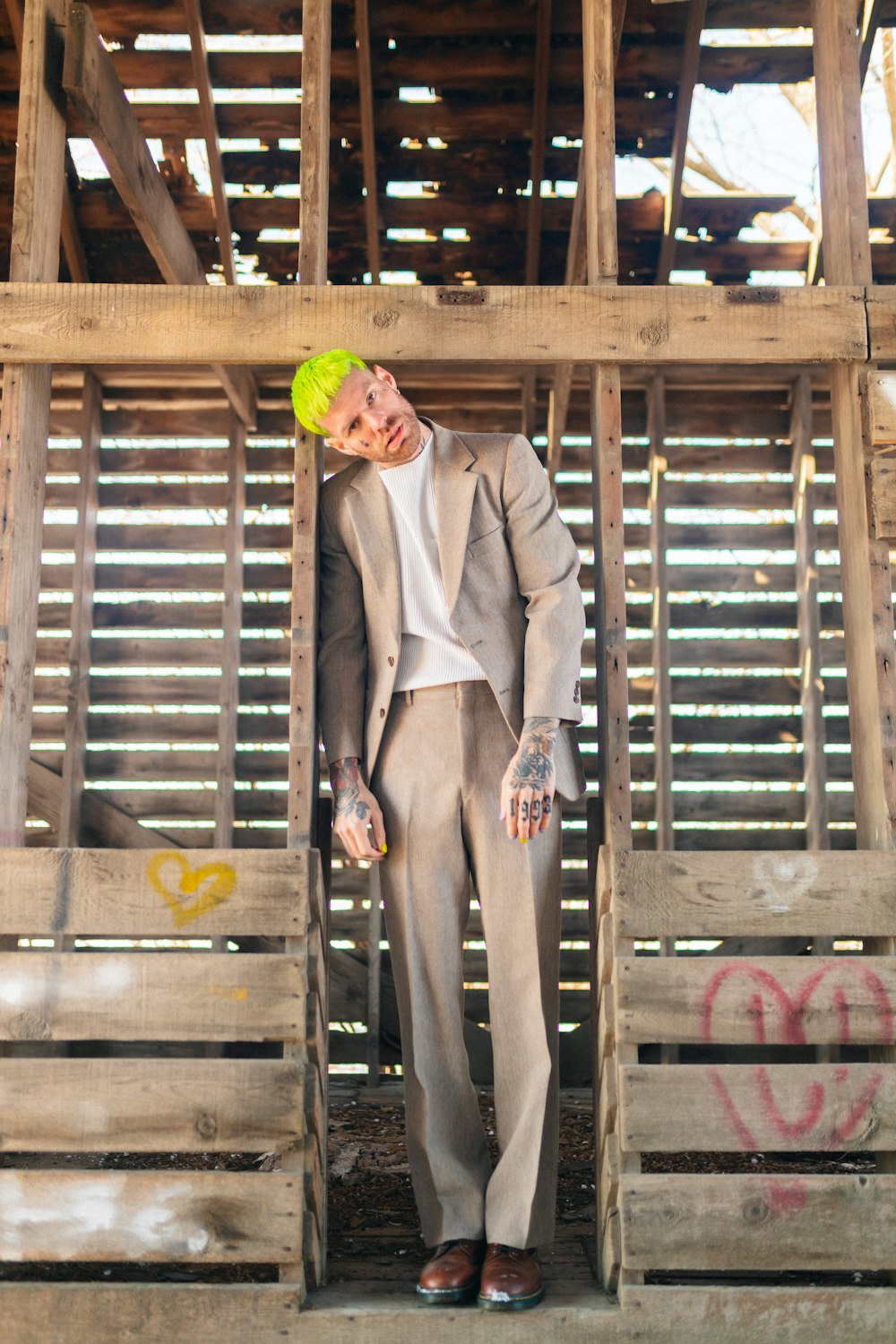 a man in a suit and tie holding a yellow frisbee