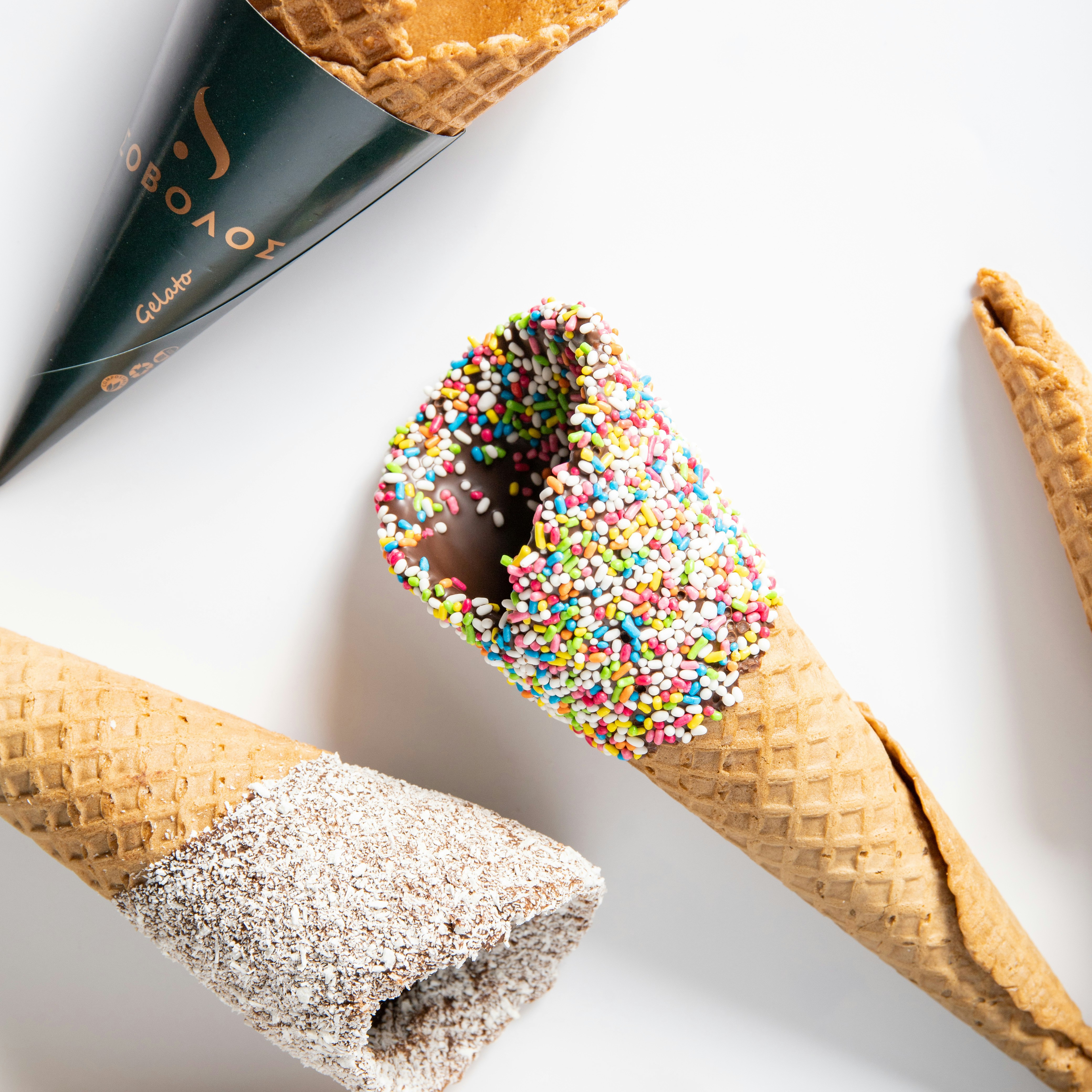 Three cones of ice cream with sprinkles and chocolate photo Free