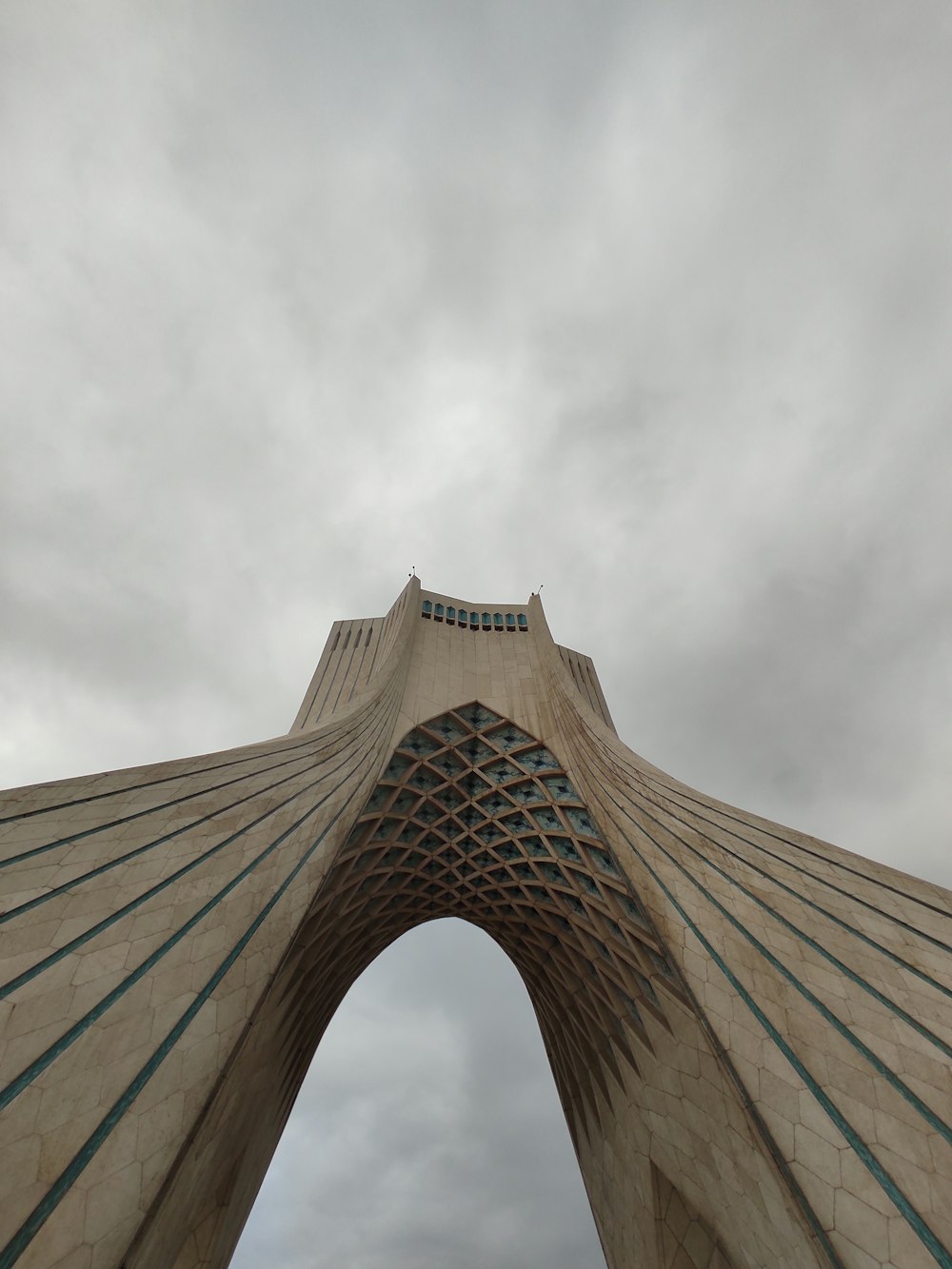 a very tall building with a sky in the background