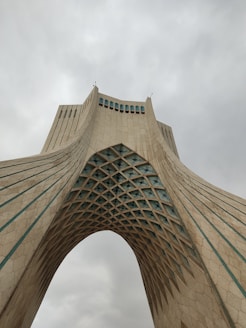 a very tall building with a sky background