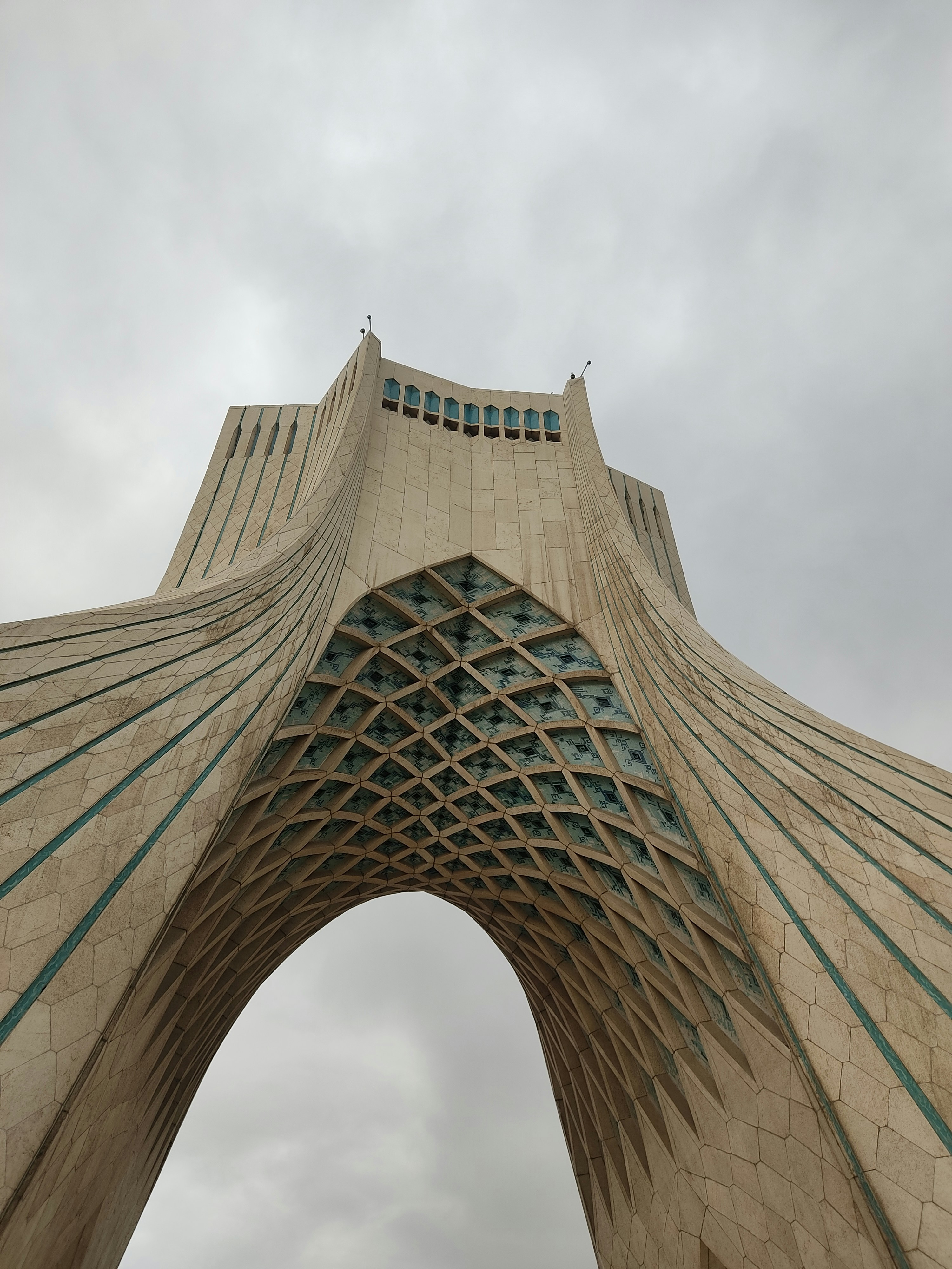 a very tall building with a sky background