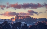 A majestic mountain range under a dramatic sunset.