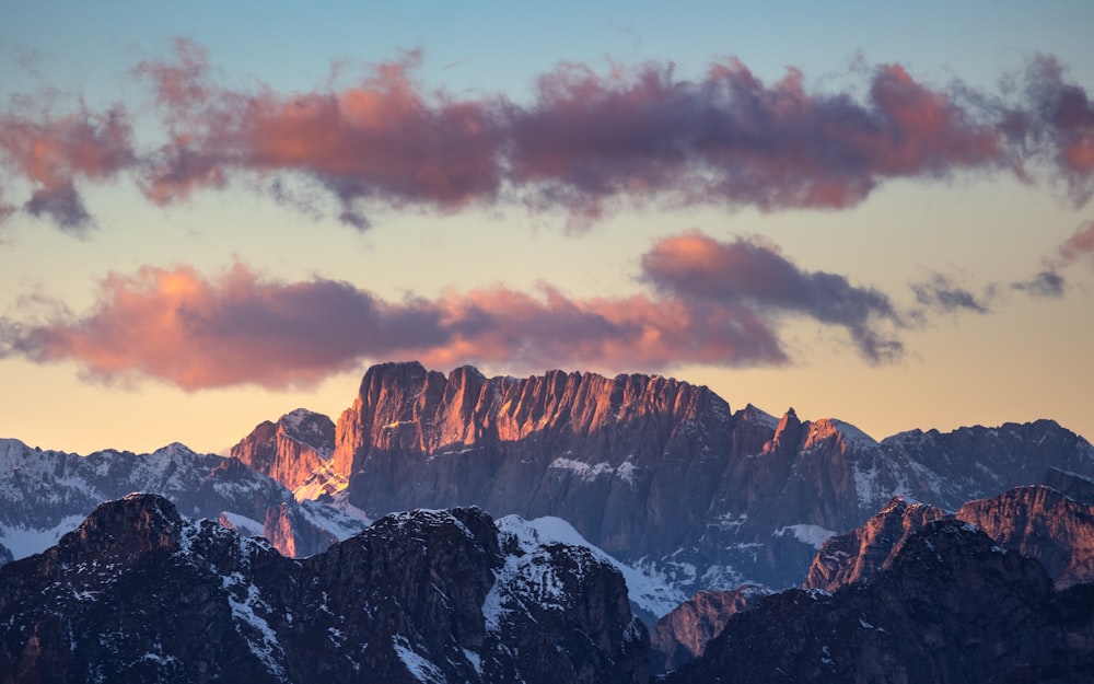 a view of a mountain range at sunset