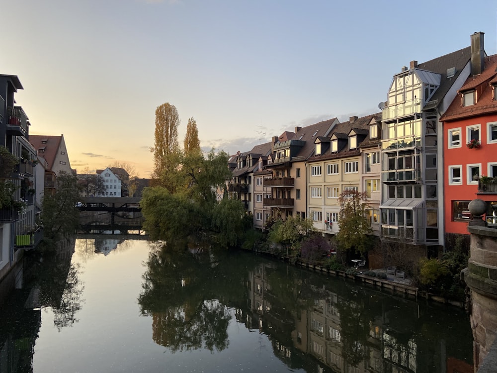 a river running through a city next to tall buildings