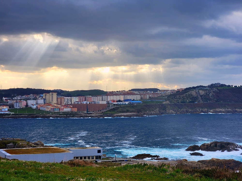 a view of a body of water with buildings in the background