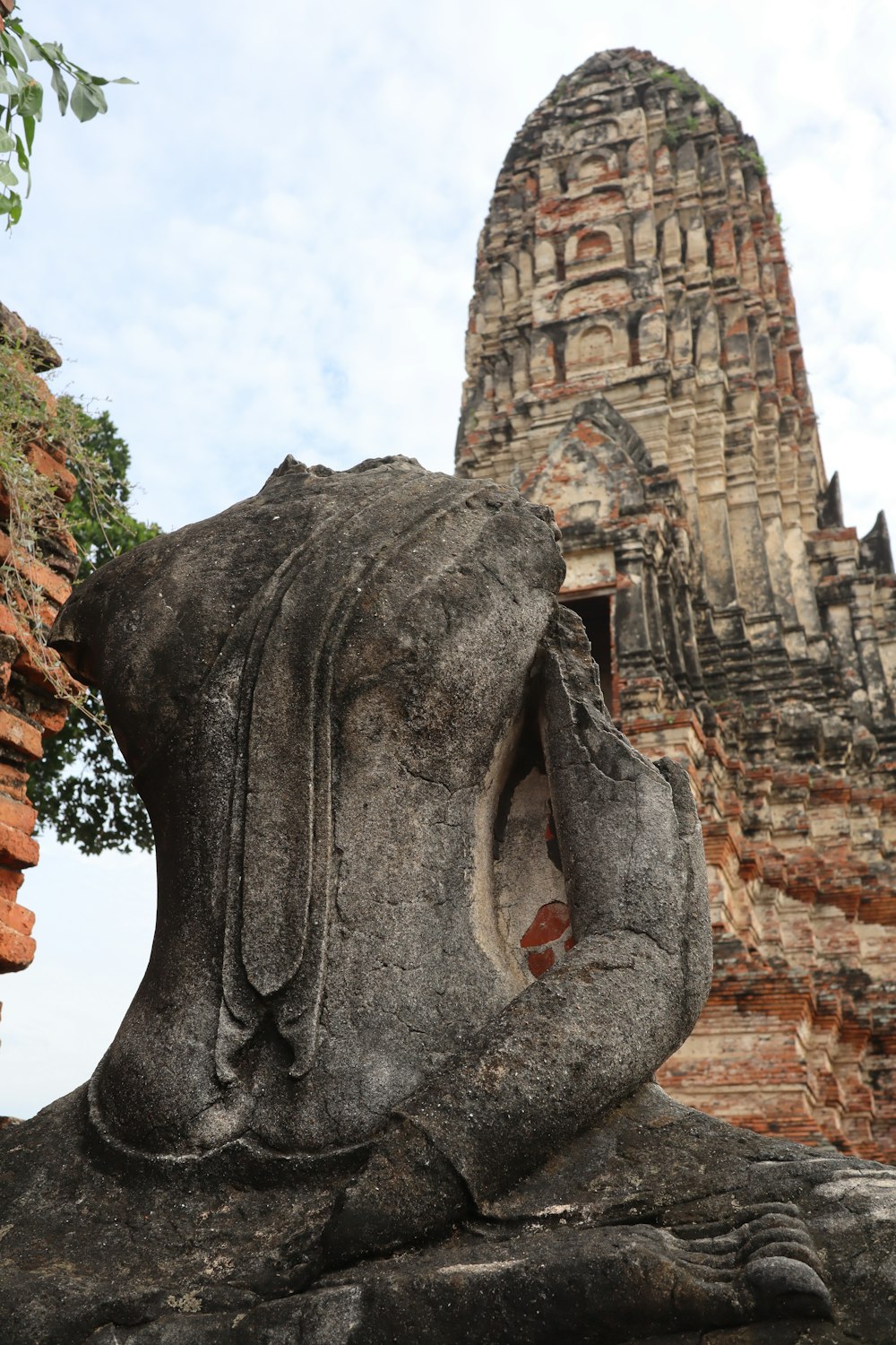 a statue of a person with a head in his hands