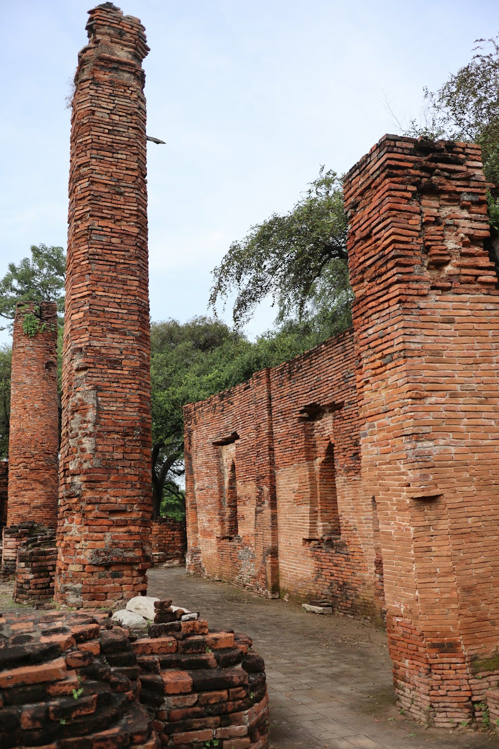 a couple of tall brick towers sitting next to each other